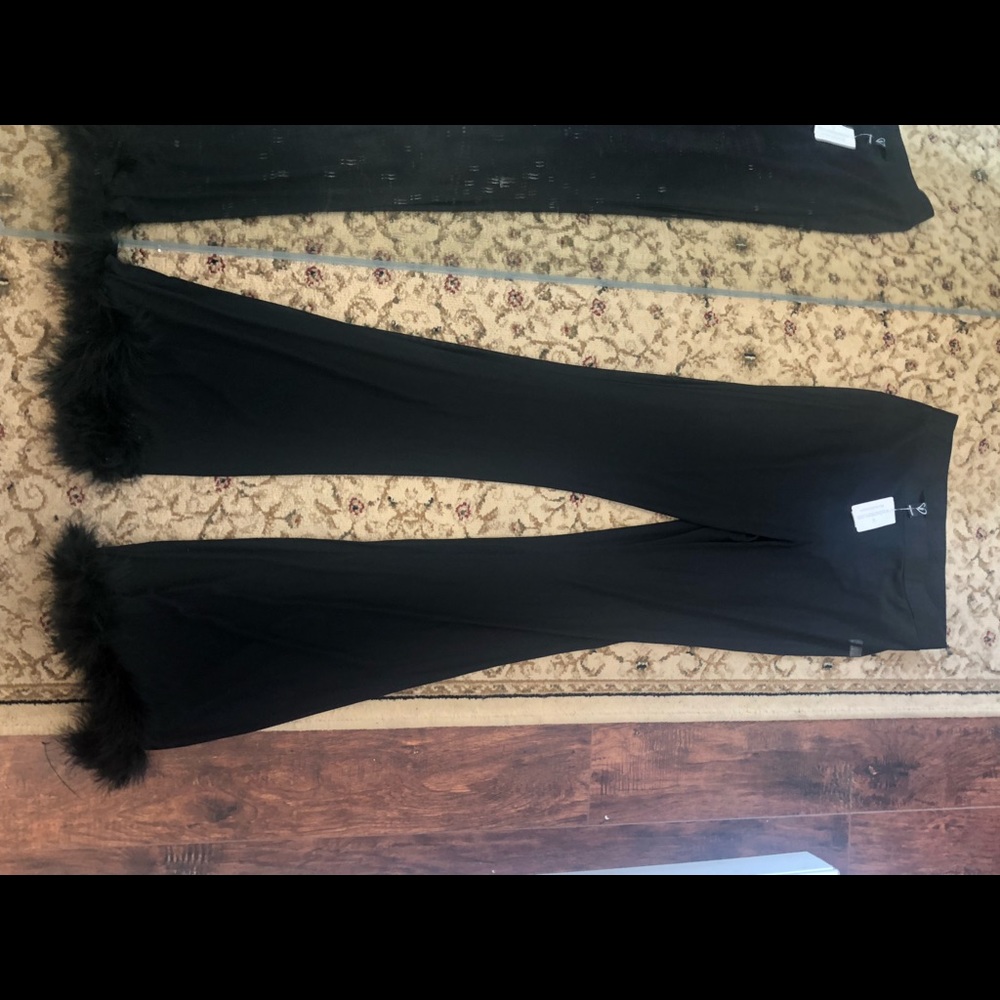 Black see through pants with fuzzys on bottom
